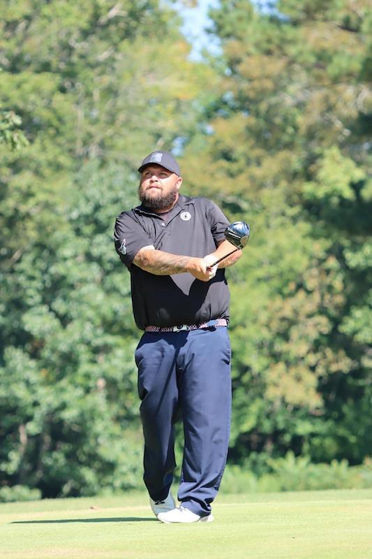 Man playing golf.